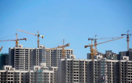 Fiscal stimulus has fueled rapidly growing local debt—and many questionable real estate projects. (Bloomberg)
