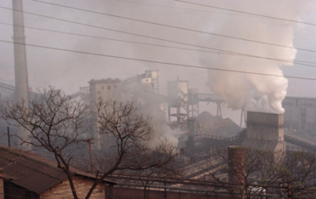 More than a year after the Air Pollution Action Plan was initiated, enforcement of emissions standards remains a major issue. Pictured above, a Chongqing industrial plant.