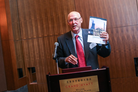 Paulson Institute Chairman Hank Paulson kicks off the Stronger Markets, Cleaner Air reception by holding up a copy of the series' background report entitled Climate Change, Air Quality and the Economy: Integrating Policy for Economic and Environmental Prosperity