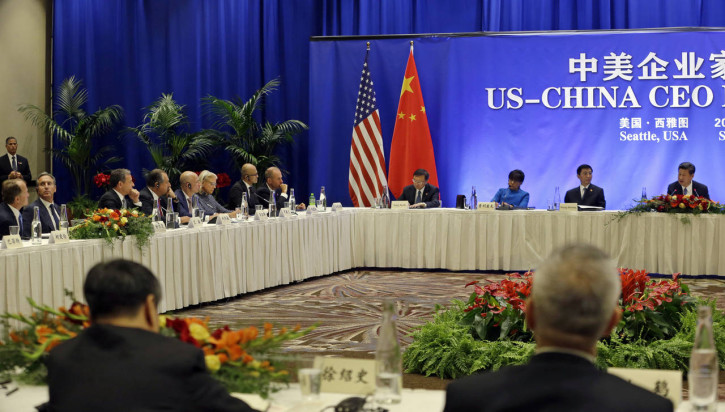 U.S. CEO's at left listen as Chinese President Xi Jinping, right, speaks at the Paulson Institute's U.S.-China business roundtable, Wednesday, Sept. 23, 2015, in Seattle. (AP Photo/Elaine Thompson)