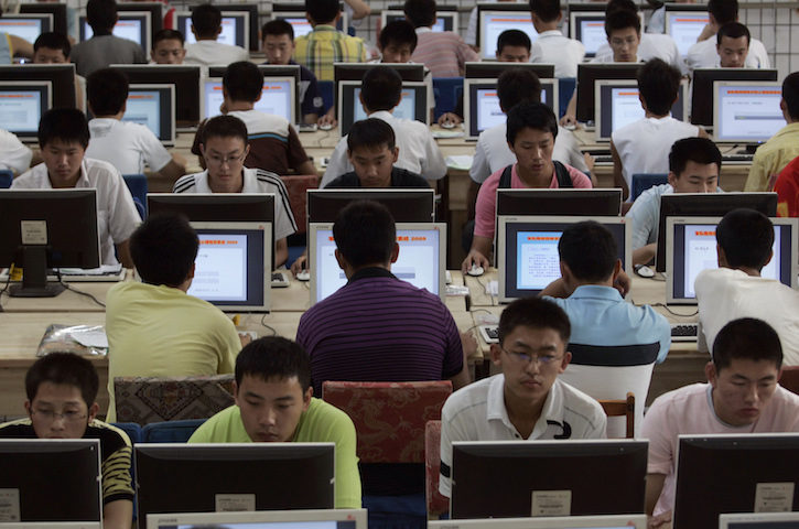 Customers use computers at an internet cafe in Taiyuan, Shanxi province