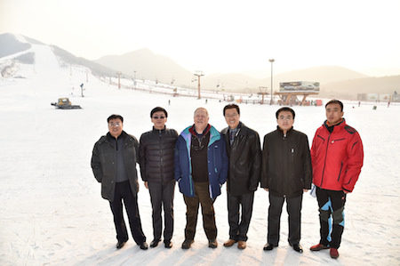 Local officials pose with international partners at the Yuyang Ski Resort in Pinggu, the largest in Beijing.